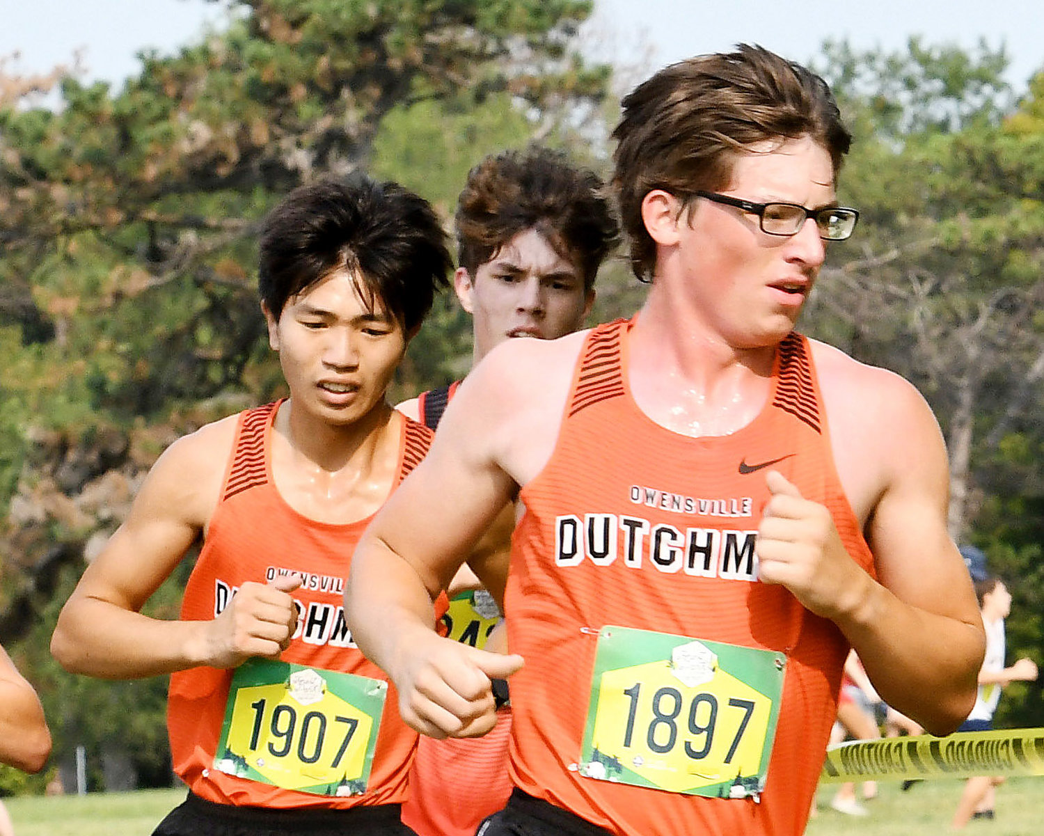 Freddy Zheng and Noah Holtmeyer (from left) compete during the varsity boys race Saturday at Forest Park in St. Louis.